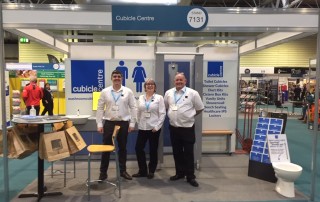 Cubicle Centre Staff standing in front of their exhibition stand